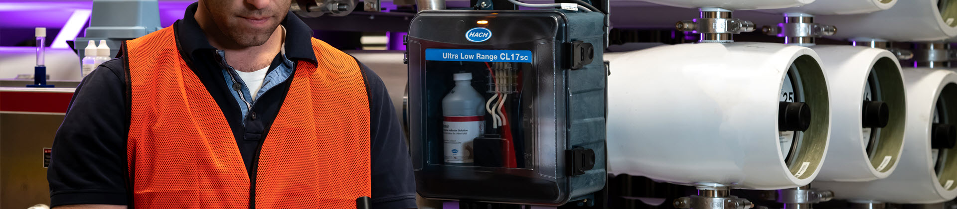 An EZ Series Online Analyzer with colorful smoke in the background.