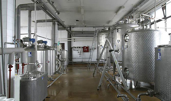 a line of brewing tanks