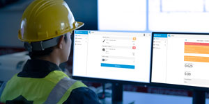 Water monitoring professional overlooking smart water monitoring display